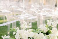 53 modern lux wedding ceremony space decor done with white blooms and ghost chairs is simple and very chic