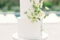 54 a beautiful white wedding cake decorated with some white wildflowers is a messy and lovely idea for a summer wedding