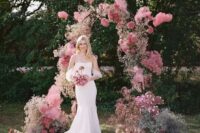 56 a modern pink wedding arch with pink and mauve blooms looks very eye-catchy and bright and adds color to the space