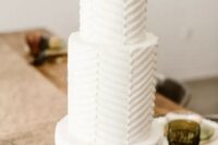56 a white chevron pattern wedding cake with a sugar cactus and a bloom for a desert wedding