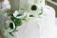 58 a white textural buttercream summer wedding cake decorated with white anemones and greenery is a cool idea to try