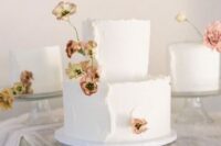 59 a white wedding cake with plenty of texture and a raw edge, dried blooms are amazing for a lovely summer wedding