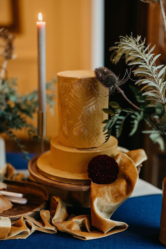 an elegant mustard wedding cake with a fern tier and some dried blooms and ribbon is a chic and catchy idea to rock at a fall wedding