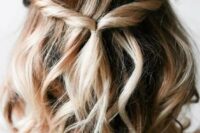 a boho half updo with twists, waves and some dimension and volume is perfect for a boho wedding