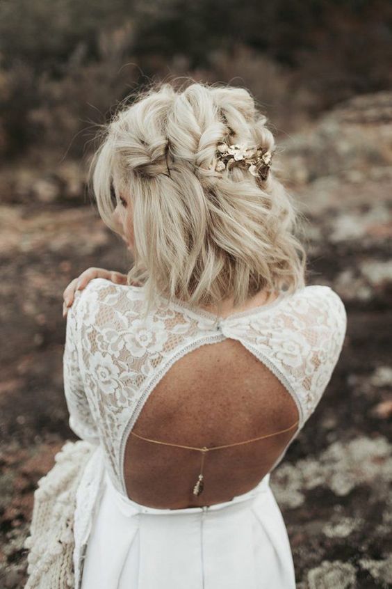 a catchy blonde medium half updo with large twisted braids and gold floral hairpins is a chic and cool idea