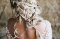 a catchy twisted and braided half updo with locks down and a beautiful embellished hair vine is amazing