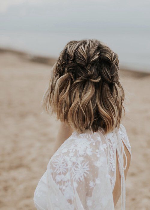 a chic medium half updo with large vertical braids and blonde balayage is a catchy idea for a boho bride
