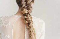 a very sleek and thick braid for long hair with highlights to create a texture