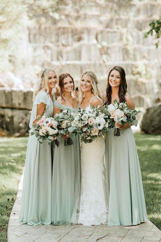 lovely sage grene maxi bridesmaid dresses with mismatching necklines are amazing for a spring or summer wedding