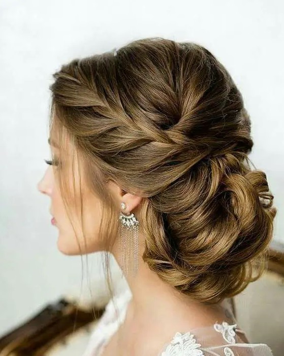 a braided low side updo looks gorgeous and fits a lot of wedding styles, it's perfect for long hair