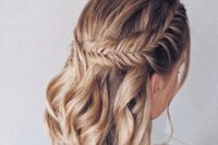 10 a boho wedding half updo on medium hair, with a large fishtail braid on one side and waves down is a stylish solution