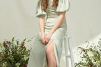 11 a lovely sage green midi bridesmaid dress with puff sleeves, a high neckline and a side slit plus neutral shoes is wow