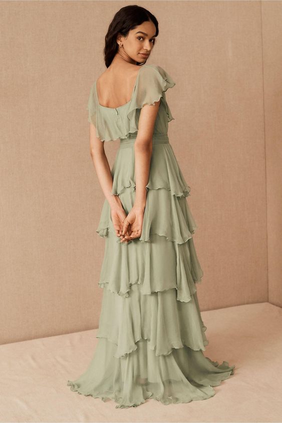 a pretty sage green tiered maxi bridesmaid dress with cap sleeves and a square cut back is a gorgeous idea