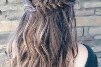 14 a wavy half updo with a thick fishtail braid on one side and twisted hair on the second