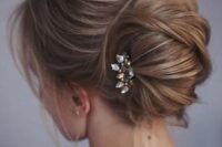14 one more catchy idea of a messy chignon and twists and locks down and a small rhinestone hairpiece