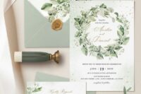 15 a beautiful sage green wedding invitation suite with a sage green envelope, some greenery and blooms printed