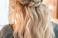 15 a boho wedding half updo with a messy voluminous top, a double braided halo and waves down plus bangs