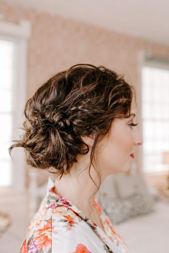 a messy and cool wavy side updo with some lcoks down and a wavy top is ideal for medium length hair