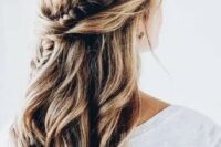 16 a twisted and braided half updo with messy beachy waves for a boho or free-spirited bride