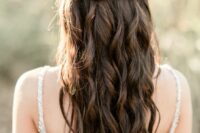 17 a braided half up half down hairstyle with a Dutch braid accent, waves down is a cool and chic idea for a boho bride