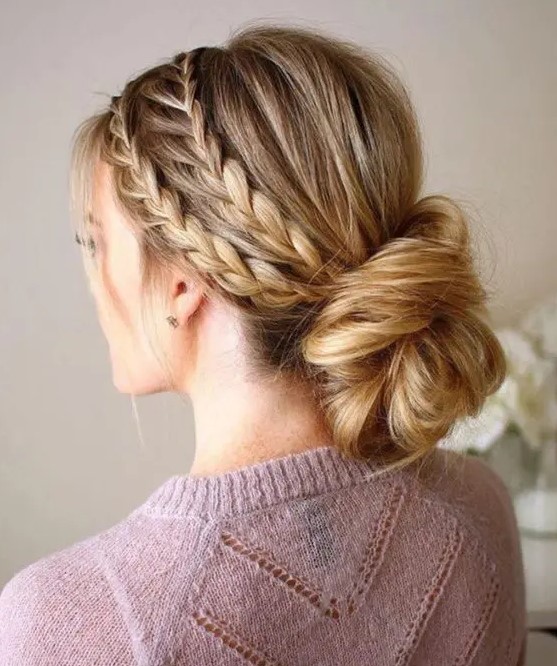 A double braided halo with a low twisted chignon guarantees a picture perfect look for the whole day