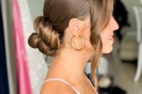 18 a beautiful twisted low bun with a sleek top and some wavy locks framing the face is a cool and chic idea to rock
