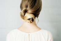 19 a beautiful twisted low bun with an ombre blonde touch is a chic idea for long hair, it can be rocked with many bridal styles