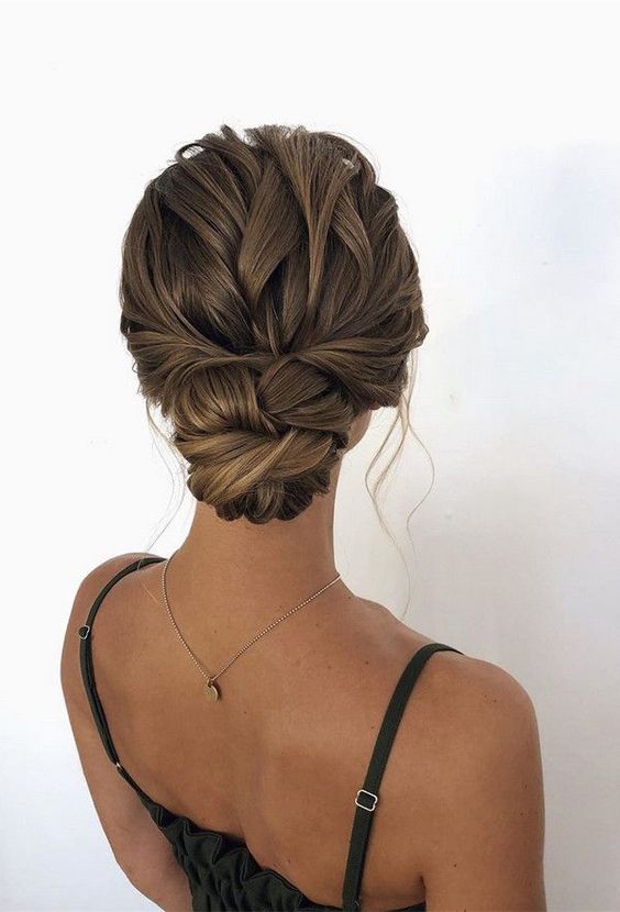 a cool twisted low bun with a twisted loose top and locks down is a chic and stylish idea for long hair, it can be a fit for many bridal styles