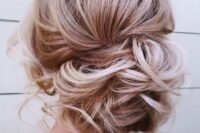 21 a messy curly low side bun with some curls down is a great idea for an effortlessly chic look