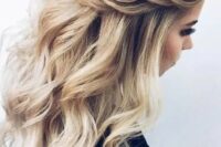 22 a chic wedding half updo with braids on the front, waves down and a messy volume on top for a romantic bride