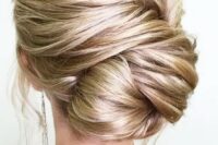 22 a large twisted low bun is a very chic option, which will easily fit a more formal look