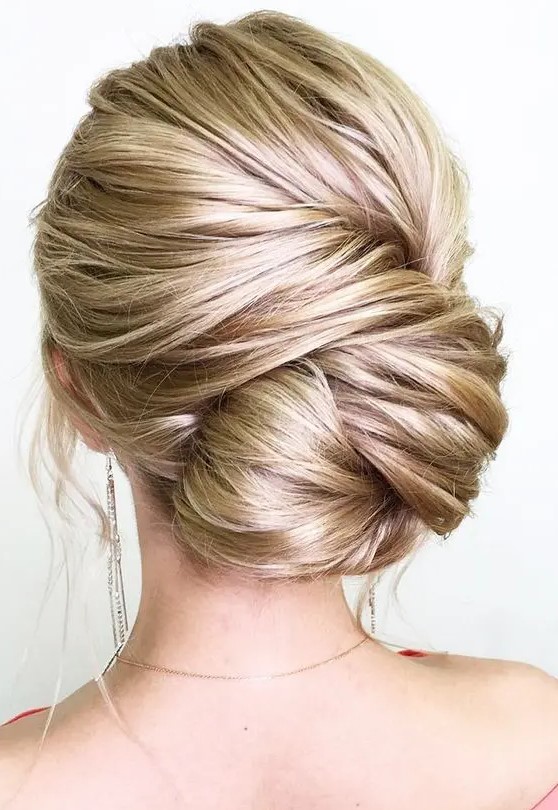 a large twisted low bun is a very chic option, which will easily fit a more formal look