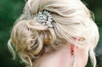 22 a messy curly updo for medium length hair with a rhinestone hairpiece and some locks framing the face is amazing