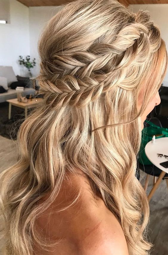 a classy boho half updo with a double braided halo and waves down plus a bump requires no accessories as it's gorgeous itself