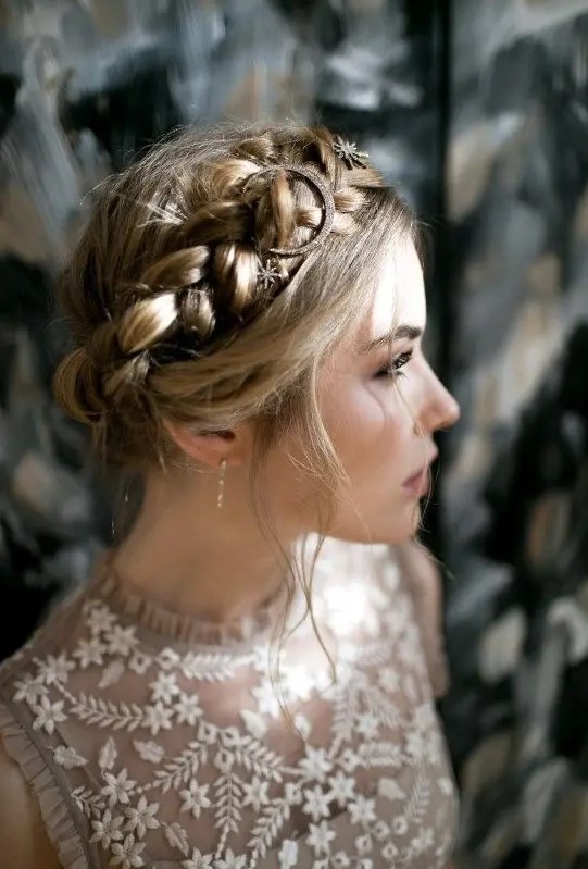 a halo braided updo with some star hair pins and a moon one for an ultimate boho look