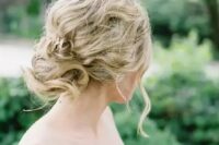 25 a messy wavy and twisted updo for an effortlessly chic bride, such an updo can be worn with long or medium length hair