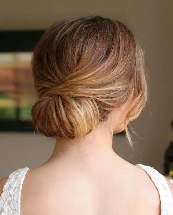 a low twisted chignon looks cute and elegant and is very easy to recreate, it will fit many formal bridal looks