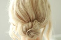 28 a messy twised low bun with a messy bump on top and some locks down is a chic and cool idea if your style isn’t too formal