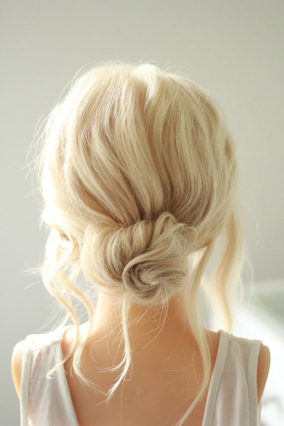 a messy twised low bun with a messy bump on top and some locks down is a chic and cool idea if your style isn't too formal
