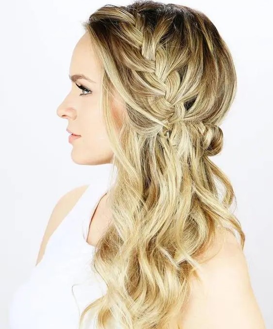 a side braided half updo with waves is a trendy idea with a twist to a usual braid