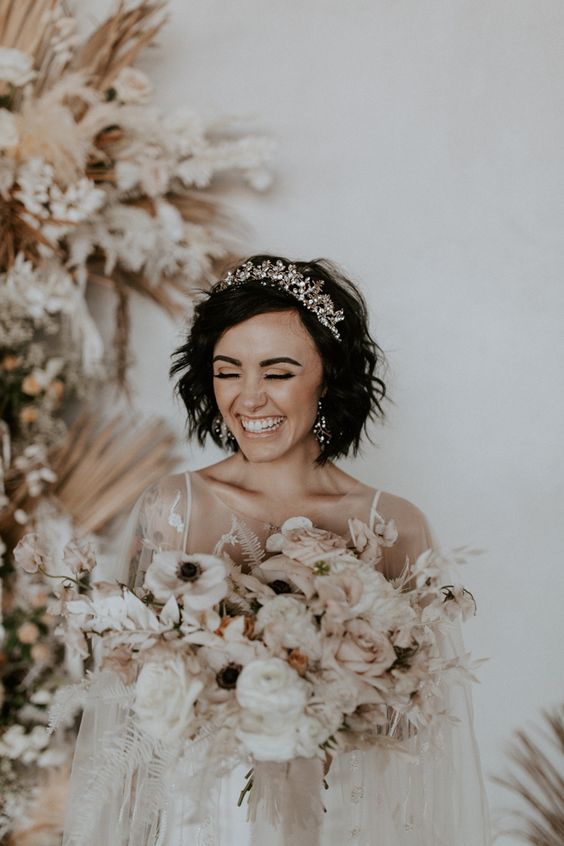 a textured feathered black bob with a gorgeous rhinestone tiara is a fantastic look for a wedding, it's amazing