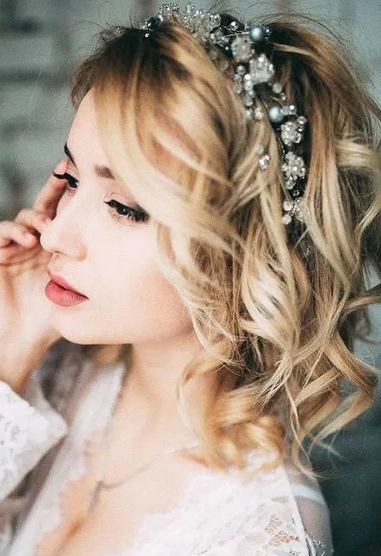 short and wavy blonde hair with a crystal and bead tiara is amazing for a modern glam bride
