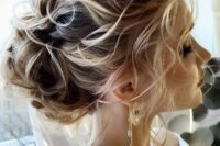 33 a wavy updo with a low chignon, a wavy volume on top and some locks down is a chic and cool idea for a wedding