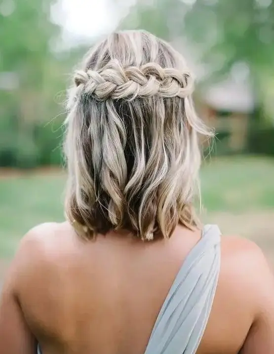 wavy hair down with a braided halo is a nice idea for those who have long bob