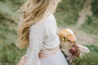 35 long hair down plus a double braided halo are a great combo for a boho bride, it looks chic and very effortless