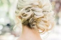 37 a curly side updo with some locks down for a elegant and effortless feel is a very chic and stylish beach and not only beach wedding idea