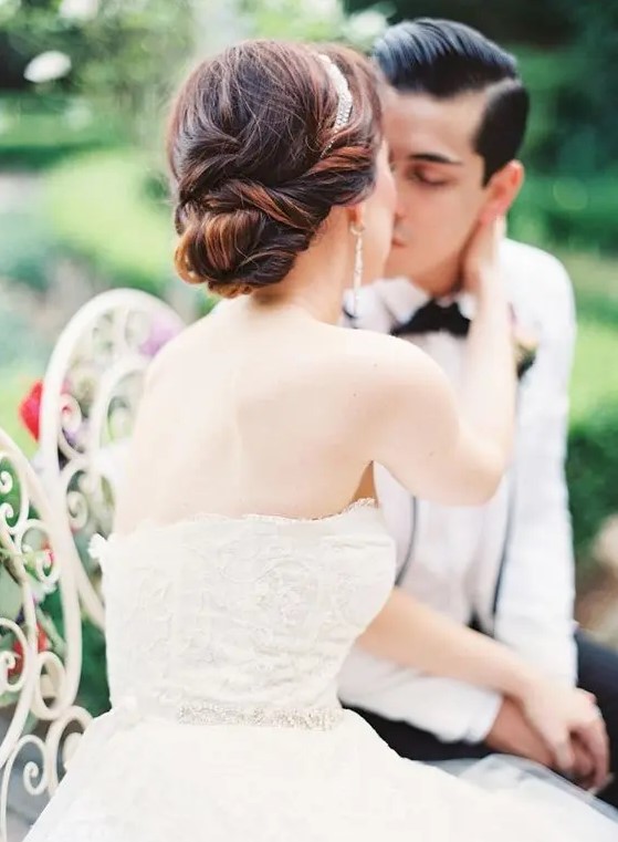 a twisted low bun with a rhinestone headband for timeless elegance is a stylish idea for a formal bride