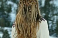 a viking-inspired wedding hairstyle, a half updo with a double braided halo and some braids hanging down