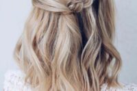 38 a pretty wedding half updo with a twisted and braided halo and waves down is ideal for medium length hair