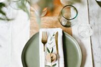 39 a stylish wedding tablescape with a sage green charger, green glasses and gold touches for elegance